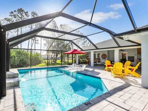 Relax in the screened lanai with a private seasonally heated saltwater pool.