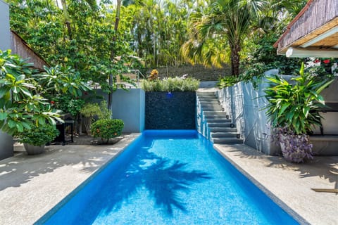 Catch a sunny day poolside to the soothing sounds of our waterfall