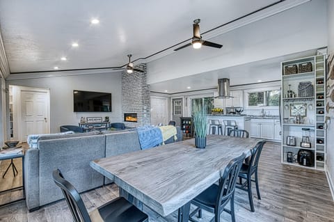 Solid Acacia wood dining table seats 7 with a great view to the lake. 