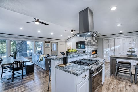 The kitchen faces the Open Concept space and looks out to the Lake. 