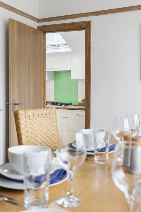 Separate dining room with dining table that seats 6. The perfect setting to enjoy a delicious meal after a long day of sight seeing.