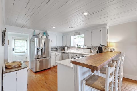 Main level kitchen with custom bar
