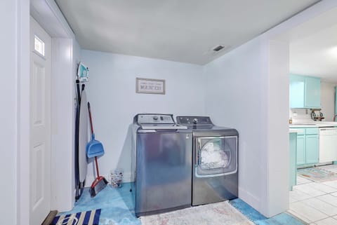 Upstairs foyer/ stairs lead down to laundry, kitchen, pool table, den,  BRs & BA