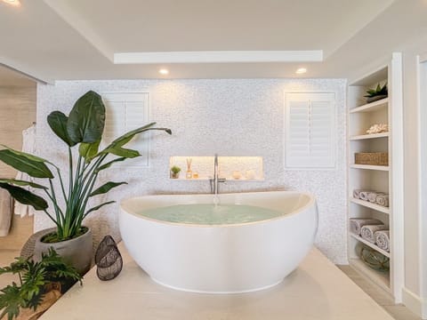 There is an ocean view from this amazing soaking tub