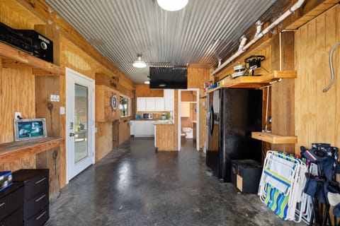 The garage has been converted to a secondary kitchen and a half bathroom. 