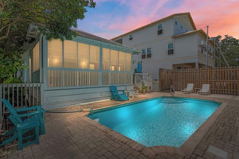 Evening pool glow creates a cozy, resort-style backyard vibe