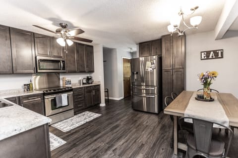 stocked kitchen and dining table for 7, additional counter space for 3 more