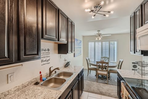Well stocked kitchen with coffee maker, blender, microwave, and basic spices.