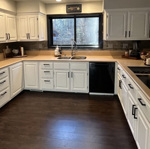 Gaze out the kitchen window to the beautifully landscaped backyard