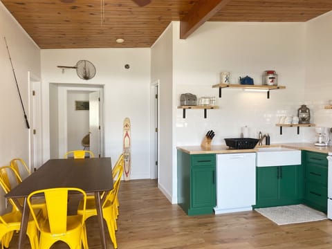 The hallway leads to the bathroom and three bedrooms.