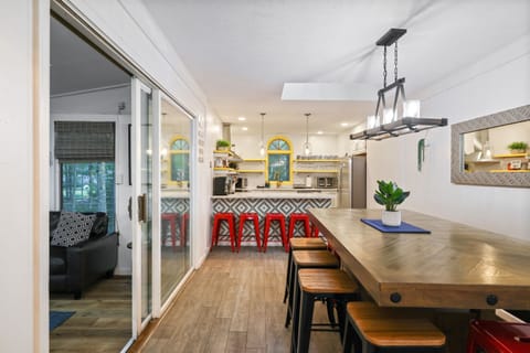 Savor delightful meals in our spacious eat-in kitchen, seamlessly blending functionality with charm. The large dining room complements the culinary experience, offering a welcoming ambiance for shared moments. 