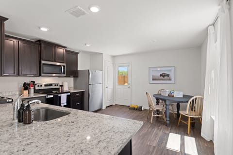 Gather, eat, or sip coffee—this open space is stocked with all the kitchen must-haves.