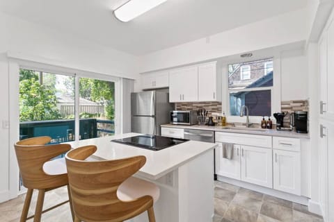 Sleek, fully stocked kitchen with high-end appliances—perfect for home-cooked meals or morning coffee.