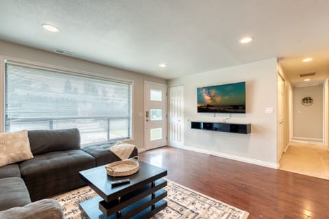 Open & inviting living room with 55" UHD TV w/ Disney + to enjoy with the family