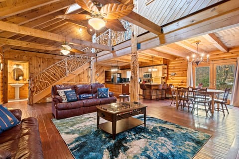 Living Room: Relax in style with high ceilings, rustic charm, and a vibrant atmosphere!