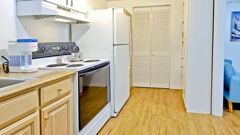 The kitchen also features access to a spacious walk-in closet.