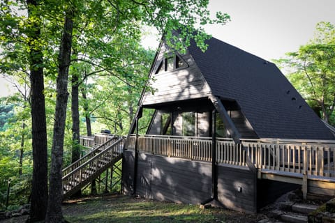 Private cabin featuring the classic A-Frame architecture with a sprawling deck.