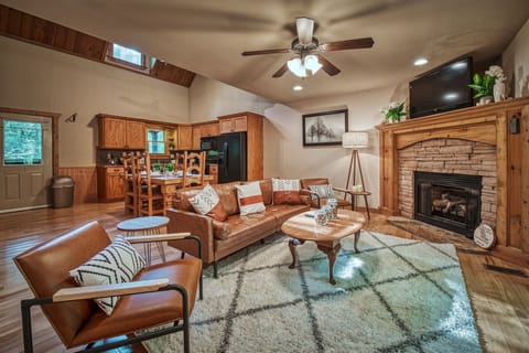 Living room with gas fireplace to stay warm and cozy. Couch has been replaced.