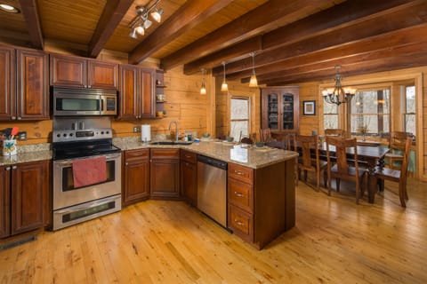 Fully stocked, open kitchen. New in 2023 -  microwave, oven and dishwasher