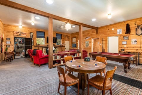 Living room with game table, pool table, toy vault, and living room set that seats 8 comfortably!