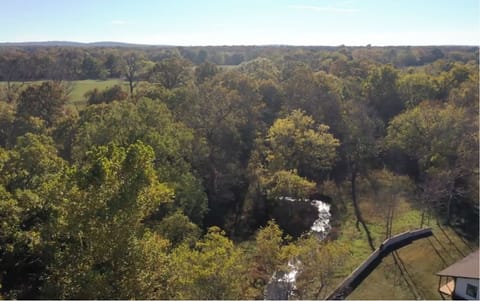 View of the creek from the cabin’s front porch. 