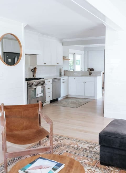 Large open living, kitchen sliders to fences in yard