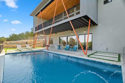 Private pool with modern terrace and seamless indoor-outdoor living