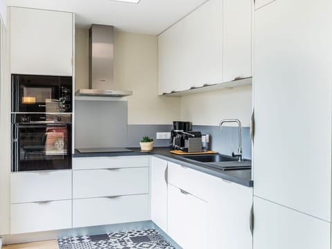 Cabinetry, Property, Kitchen Stove, Countertop, Kitchen Appliance, Home Appliance, Kitchen, Flooring, Interior Design