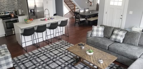 Living room 1, kitchen and dining room. Door on right leads to upper balcony.