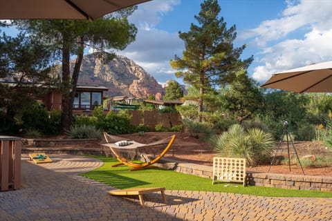 Unwind in this dreamy backyard with a hammock, telescope, and oversized games—all set against stunning red rock views. It's the perfect space to relax, play, and soak in Sedona’s magical desert beauty.