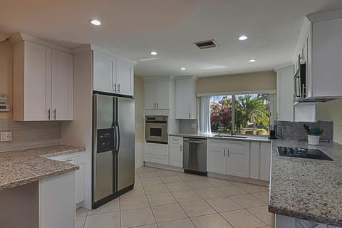 Kitchen has modern equipment and is fully stocked with utensils for your stay