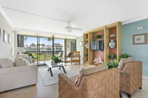 Living area and screened porch overlooking the golf course.