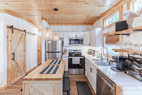 Experience a modern Boho kitchen with all dining essentials. 