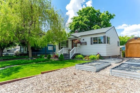 Exterior of the home with big garden and driveway parking space