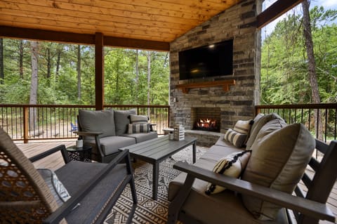 Outdoor fireplace. Great views of the yard, fire pit, and hot tub.