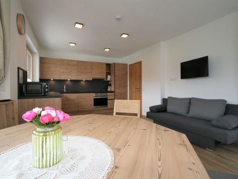 Flower, Furniture, Property, Comfort, Cabinetry, Table, Wood, Building, Living Room, Flooring