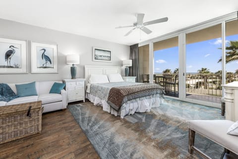 Large master suite with sleeper sofa couch, ensuite bathroom, and large balcony!