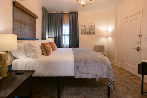Cozy bedroom with soft lighting, warm tones, and elegant decor.