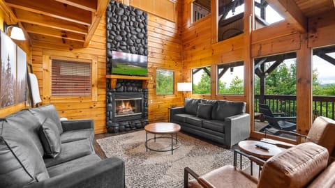 Gather in the open living room with panoramic windows