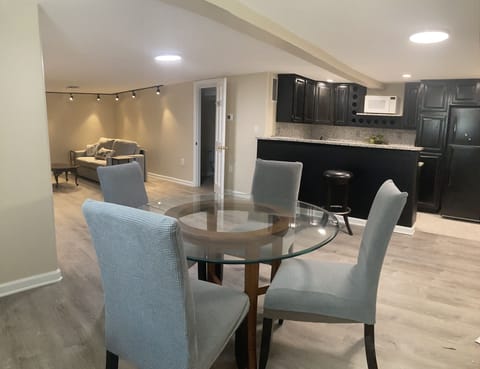 Finished basement with bar/kitchenette, brand new vinyl flooring and new fridge