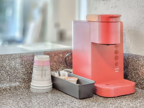 A Keurig machine with cups and a couple pods is available for every guest