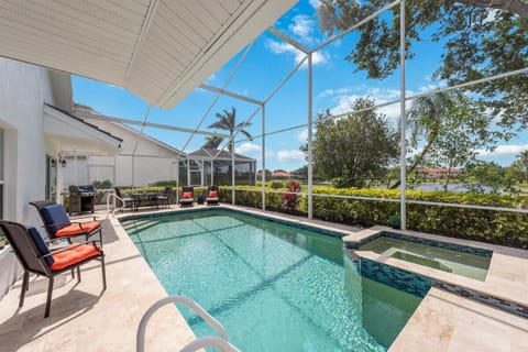 Screened pool with jacuzzi.