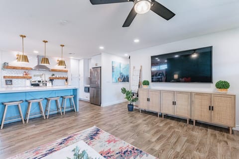 Living room alternate view showing flow to bar seating