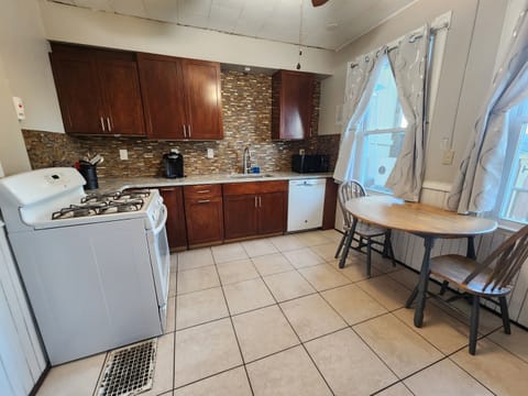 Beautiful eat in kitchen with granite surfaces. 