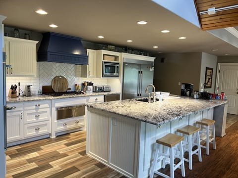 Kitchen Island, double fridge and freezer, microwave,and beverage refrigerator 