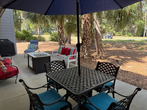 Spacious patio features golf course view with gas grill 