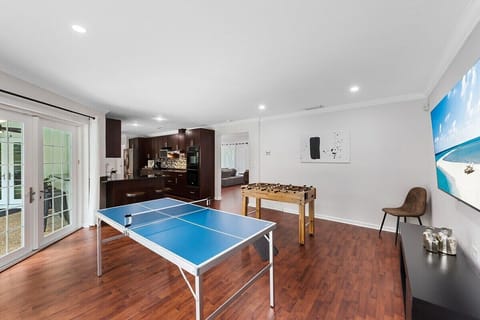 Spread out in the spacious layout of this Fort Lauderdale home, which offers 3 bedrooms & 2 full bathrooms, separate living area with a comfy sofa, a modern dining table, game room with ping pong & foosball tables, large kitchen with updated appliances and bar seating, TV's in all rooms, separate laundry room and contemporary touches throughout!