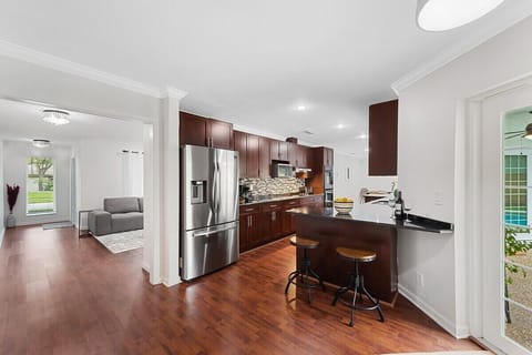 Spread out in the spacious layout of this Fort Lauderdale home, which offers 3 bedrooms & 2 full bathrooms, separate living area with a comfy sofa, a modern dining table, game room with ping pong & foosball tables, large kitchen with updated appliances and bar seating, TV's in all rooms, separate laundry room and contemporary touches throughout!