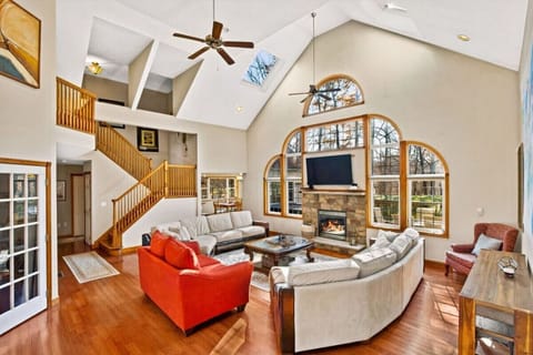 **Living room**  bring on the light! The airy living room offers a ton of natural light. Hang out on the couches for game or movie night or just spend quality time together around the gas fireplace.