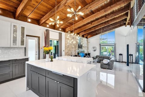 Completely open concept kitchen, dining, and living room with tons of natural light